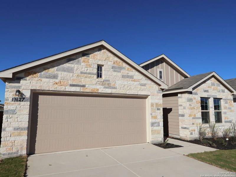 Front exterior of a new home in Winding Brook, San Antonio, TX, highlighting curb appeal (Image 20).