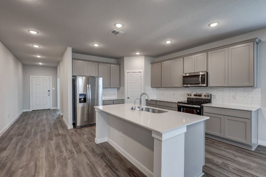 A kitchen with white cabinets. A kitchen with white cabinets.