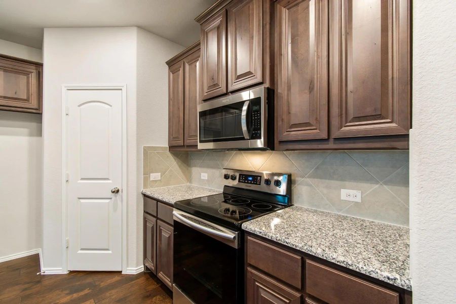 Kitchen | Concept 2844 at Hunters Ridge in Crowley, TX by Landsea Homes