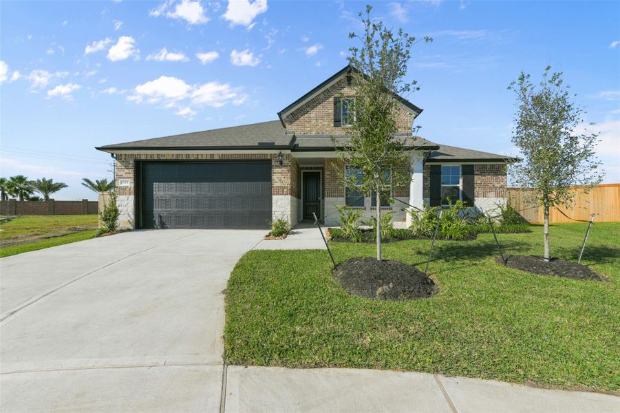 Front exterior of a new home in Lago Mar, Texas City, TX, highlighting curb appeal (Image 1).