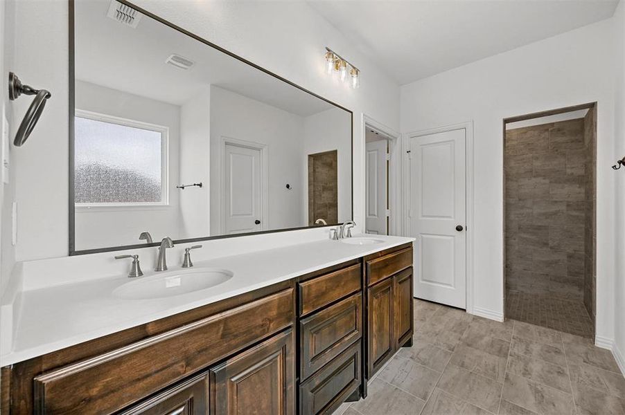 Bathroom featuring vanity and walk in shower