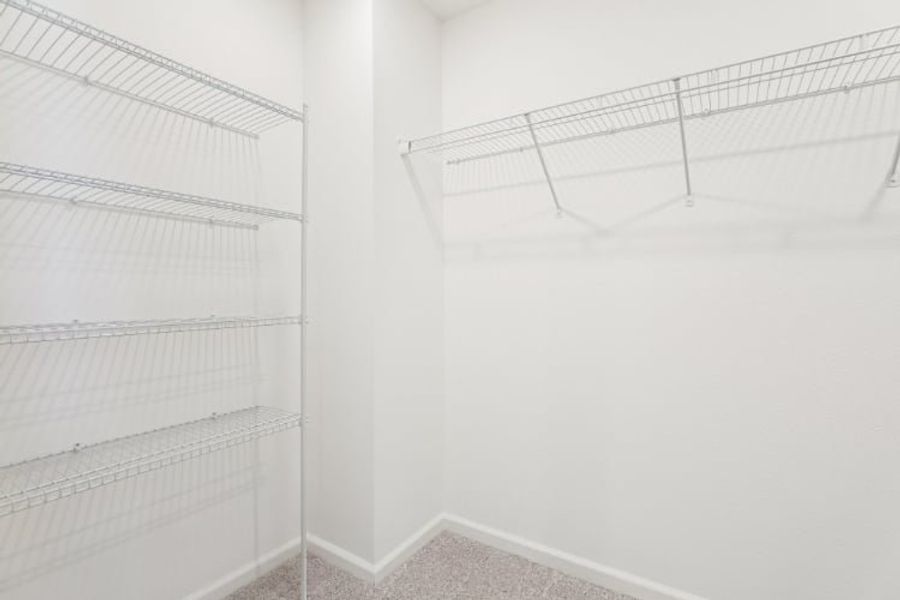 A white room with a metal railing.