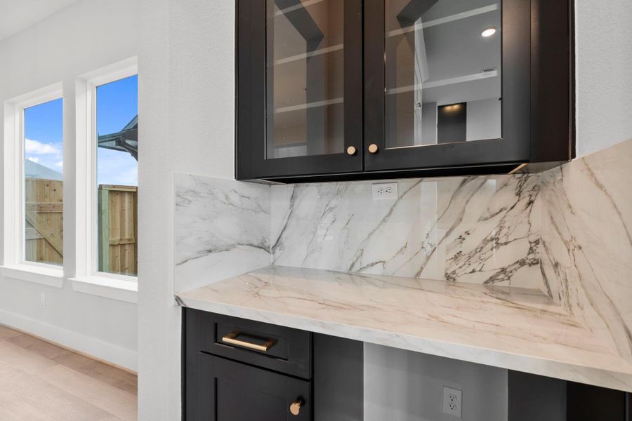 Glass cabinets for stylish storage in the butlers pantry.