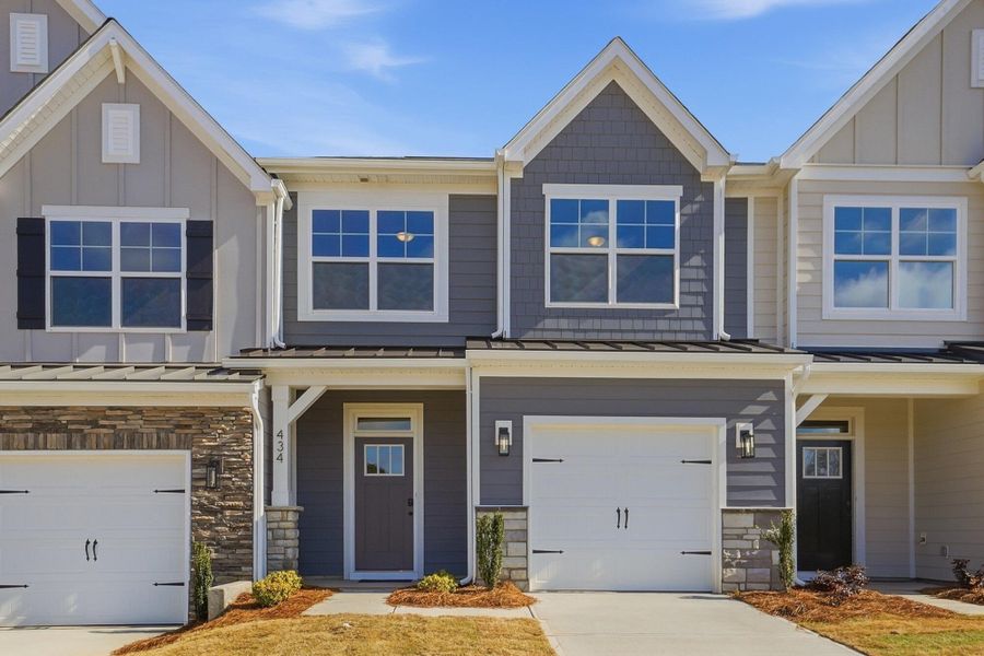 Front exterior of a new home in Blythe Mill Townhomes, Waxhaw, NC, highlighting curb appeal (Image 21). Front exterior of a new home in Blythe Mill Townhomes, Waxhaw, NC, highlighting curb appeal (Image 21).