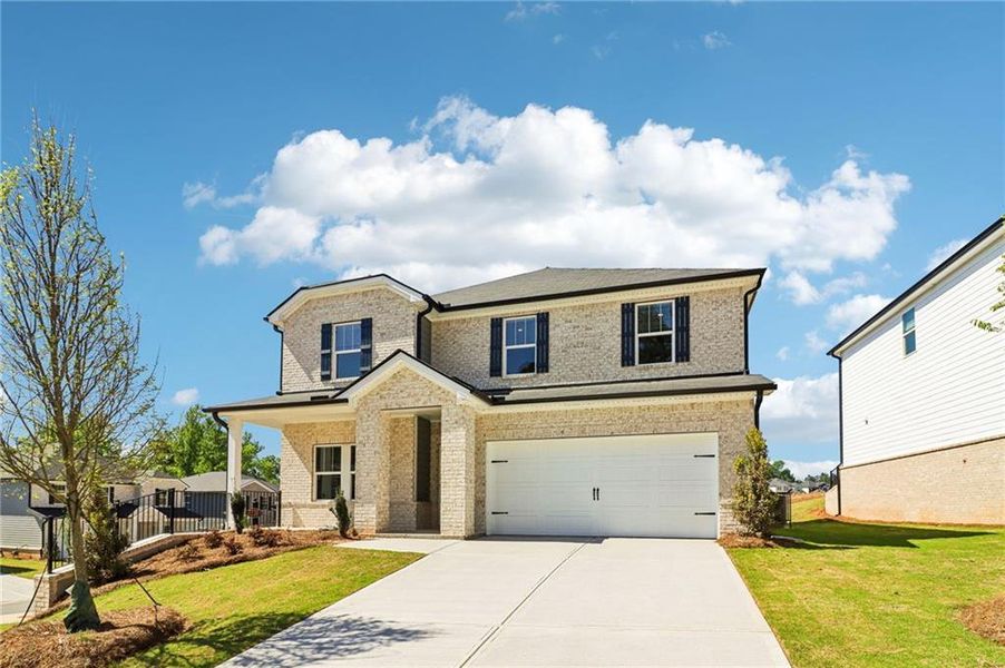 Front exterior of a new home in Harmony Manor, Fairburn, GA, highlighting curb appeal (Image 31). Front exterior of a new home in Harmony Manor, Fairburn, GA, highlighting curb appeal (Image 31).