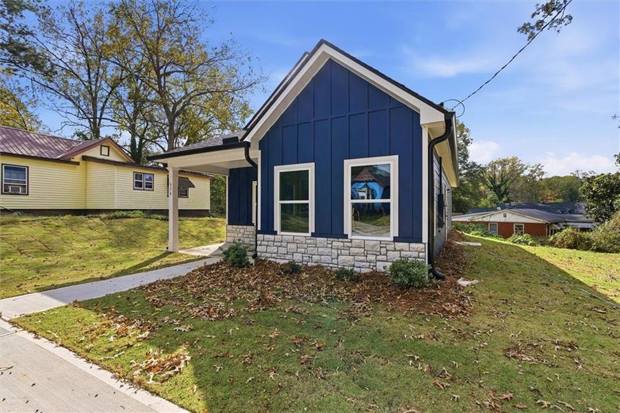 Front exterior of a new home in , Carrollton, GA, highlighting curb appeal (Image 20).