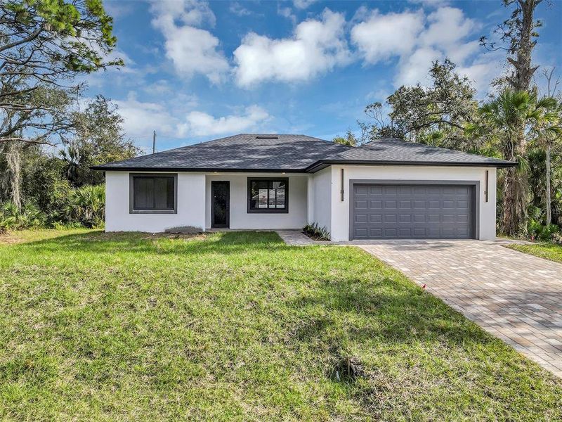 Front exterior of a new home in , Port Charlotte, FL, highlighting curb appeal (Image 1). Front exterior of a new home in , Port Charlotte, FL, highlighting curb appeal (Image 1).