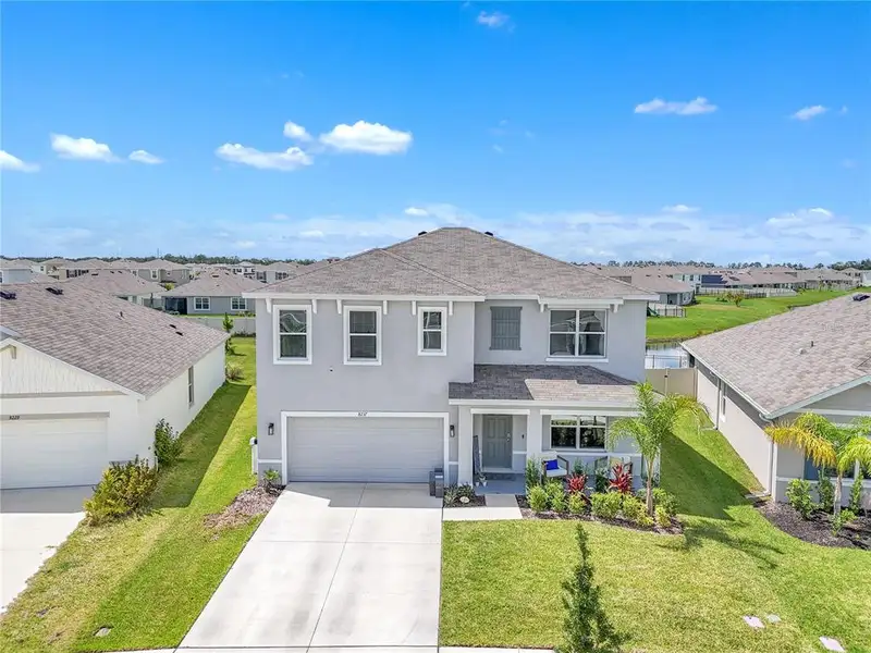 Front exterior of a new home in , Wesley Chapel, FL, highlighting curb appeal (Image 1). Front exterior of a new home in , Wesley Chapel, FL, highlighting curb appeal (Image 1).