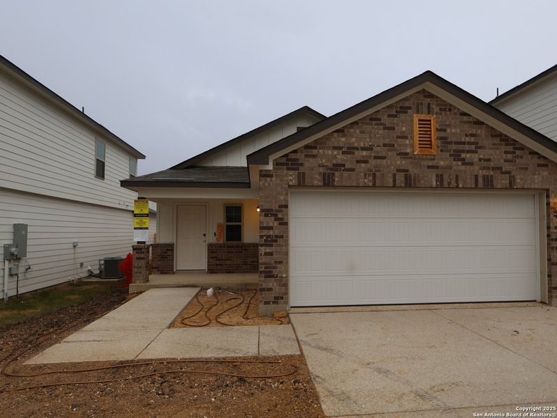 Front exterior of a new home in Paloma Park, Converse, TX, highlighting curb appeal (Image 1).