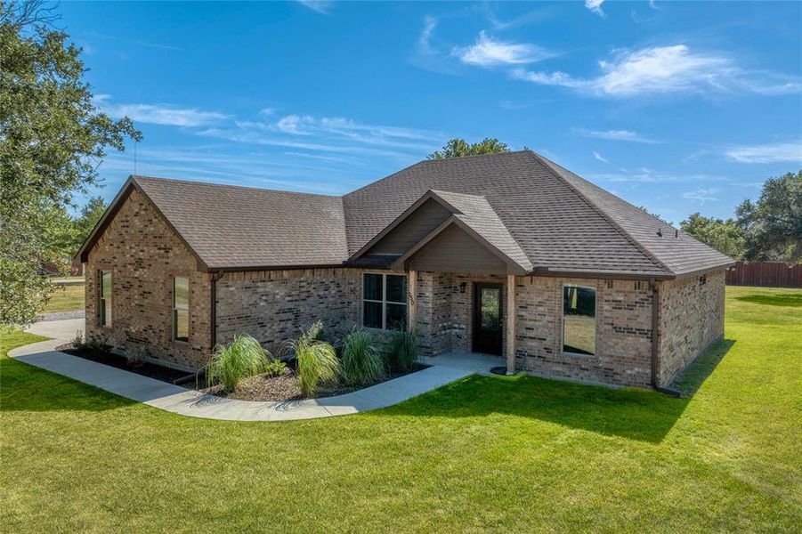 View of front of property with a front lawn