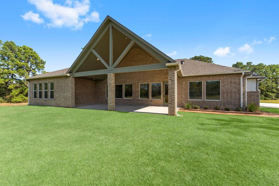 Exterior details and patio area of a home in Homestead Hill, New Waverly (Image 14).
