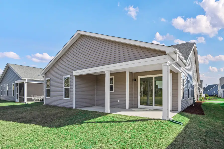 Exterior details and patio area of a home in Bridgewater - Shorehaven Village, Little River (Image 4).