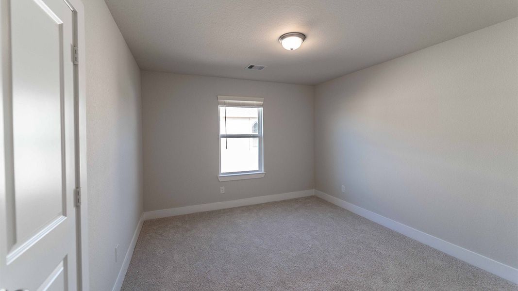 Spacious, unfurnished interior of a new home in Sunterra, Katy (Image 32).