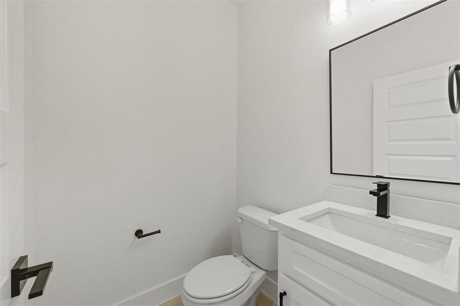 Bathroom with vanity and toilet