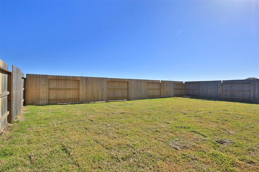 Exterior details and patio area of a home in Sunterra, Katy (Image 20).