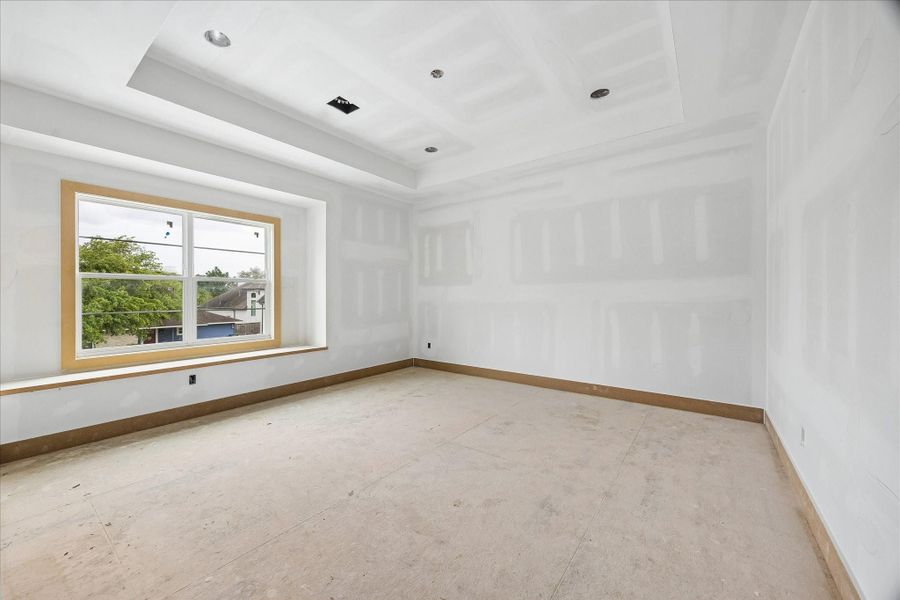 Spacious secondary bedroom with tray ceiling detail and a deep set window that draws in soft natural light. Generous wall space allows for flexible furniture placement while maintaining a bright, airy feel. Spacious secondary bedroom with tray ceiling detail and a deep set window that draws in soft natural light. Generous wall space allows for flexible furniture placement while maintaining a bright, airy feel.