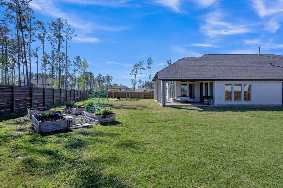 Gazebo set within the backyard, surrounded by space for gardening, relaxing, and enjoying the outdoors. Gazebo set within the backyard, surrounded by space for gardening, relaxing, and enjoying the outdoors.