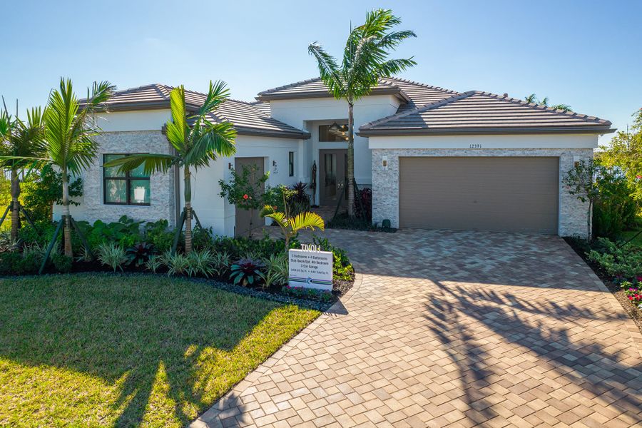 Front exterior of a new home in Valencia Parc at Riverland, Port St. Lucie, FL, highlighting curb appeal (Image 1). Front exterior of a new home in Valencia Parc at Riverland, Port St. Lucie, FL, highlighting curb appeal (Image 1).