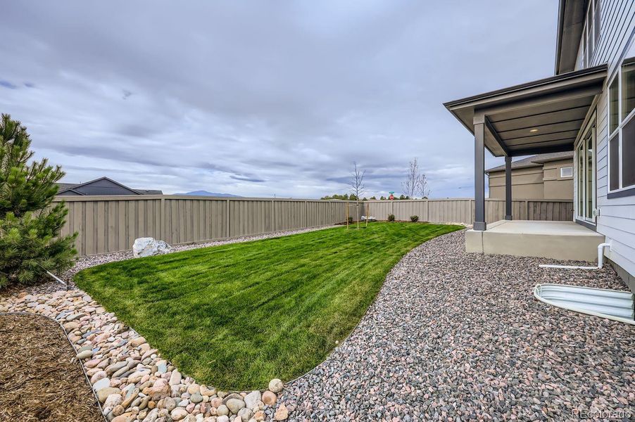 Exterior details and patio area of a home in Sterling Ranch Homestead 60s, Colorado Springs (Image 3).