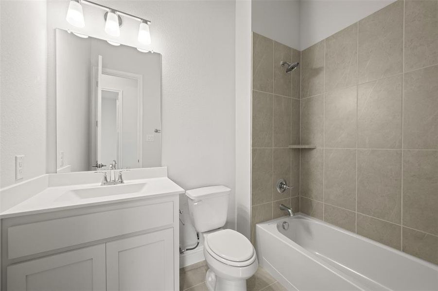 Full bathroom featuring vanity and shower / washtub combination
