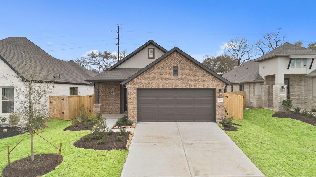 Front exterior of a new home in Escondido, Magnolia, TX, highlighting curb appeal (Image 22).