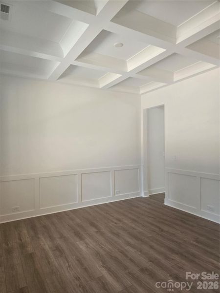 This formal dining room features a stunning coffered ceiling and elegant woodwork throughout. While perfectly suited for hosting dinner parties, the versatile layout allows this space to function equally well as a flex room, home office, or study. This formal dining room features a stunning coffered ceiling and elegant woodwork throughout. While perfectly suited for hosting dinner parties, the versatile layout allows this space to function equally well as a flex room, home office, or study.