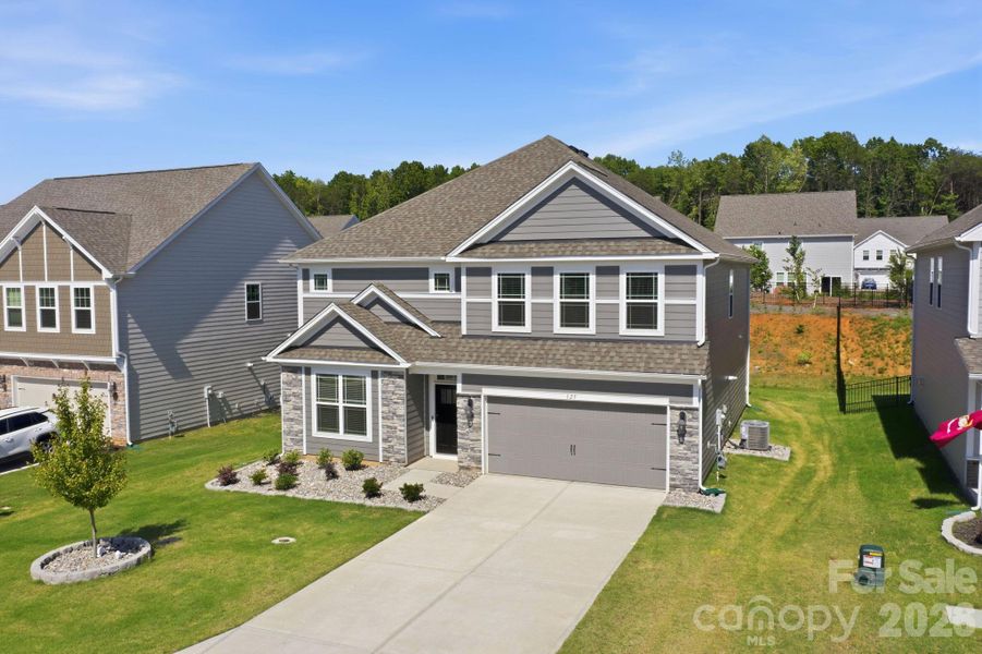 Front exterior of a new home in Falls Cove, Troutman, NC, highlighting curb appeal (Image 22). Front exterior of a new home in Falls Cove, Troutman, NC, highlighting curb appeal (Image 22).