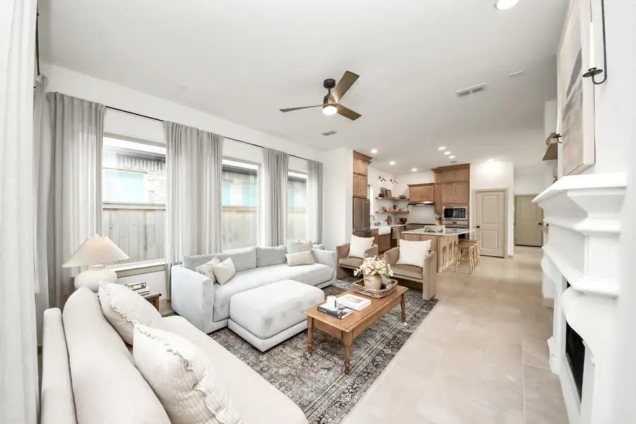 Seamless flow into a stylish kitchen designed for both everyday comfort and effortless entertaining.