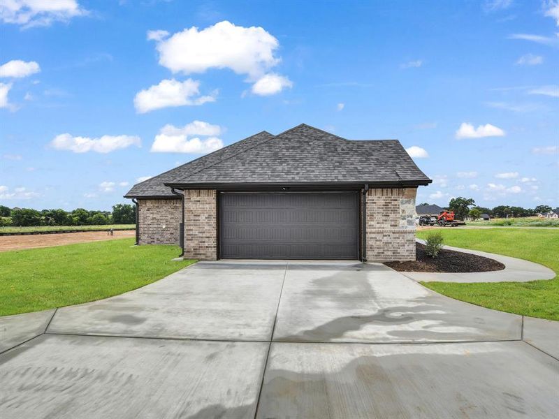 Front exterior of a new home in , Azle, TX, highlighting curb appeal (Image 1). Front exterior of a new home in , Azle, TX, highlighting curb appeal (Image 1).