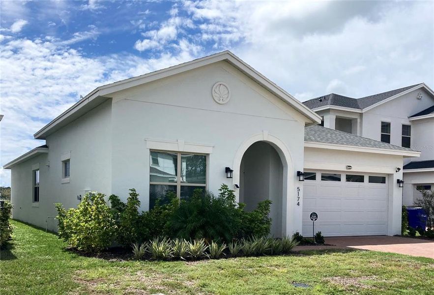 Front exterior of a new home in , St. Cloud, FL, highlighting curb appeal (Image 15).