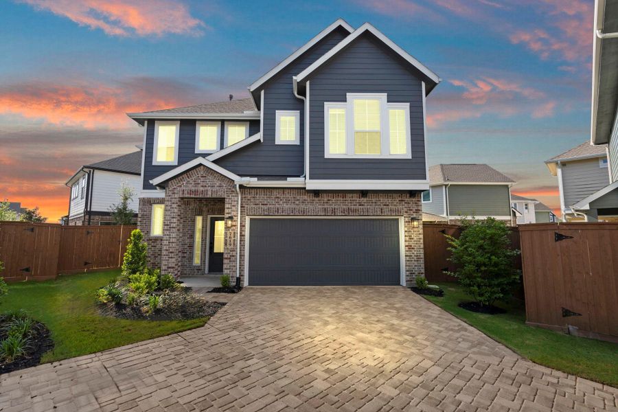 Front exterior of a new home in Elyson, Katy, TX, highlighting curb appeal (Image 21).