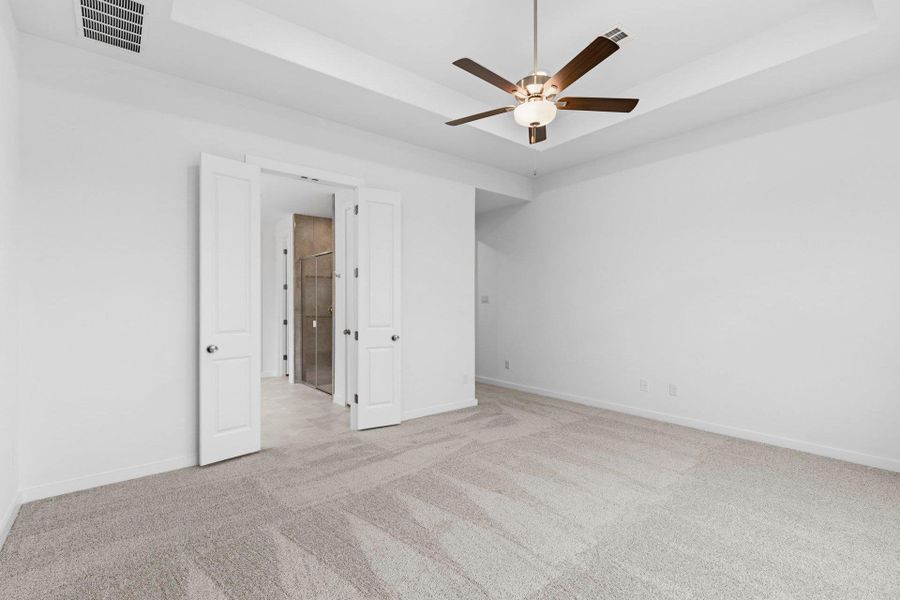 Primary Bedroom with tray ceiling