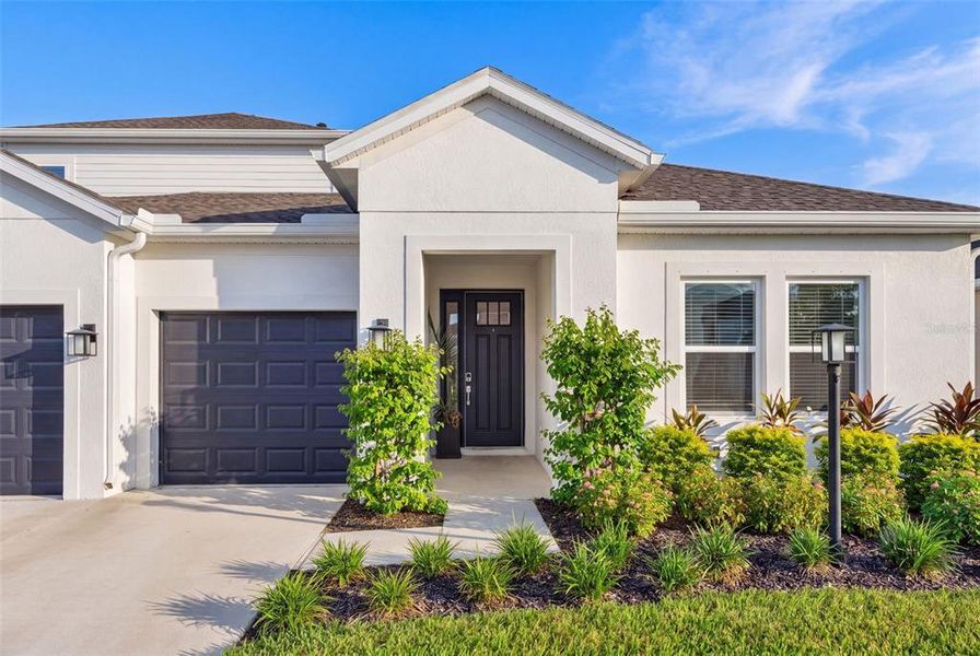 Front exterior of a new home in , Bradenton, FL, highlighting curb appeal (Image 27).