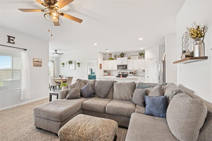 Living room featuring recessed lighting and ceiling fan