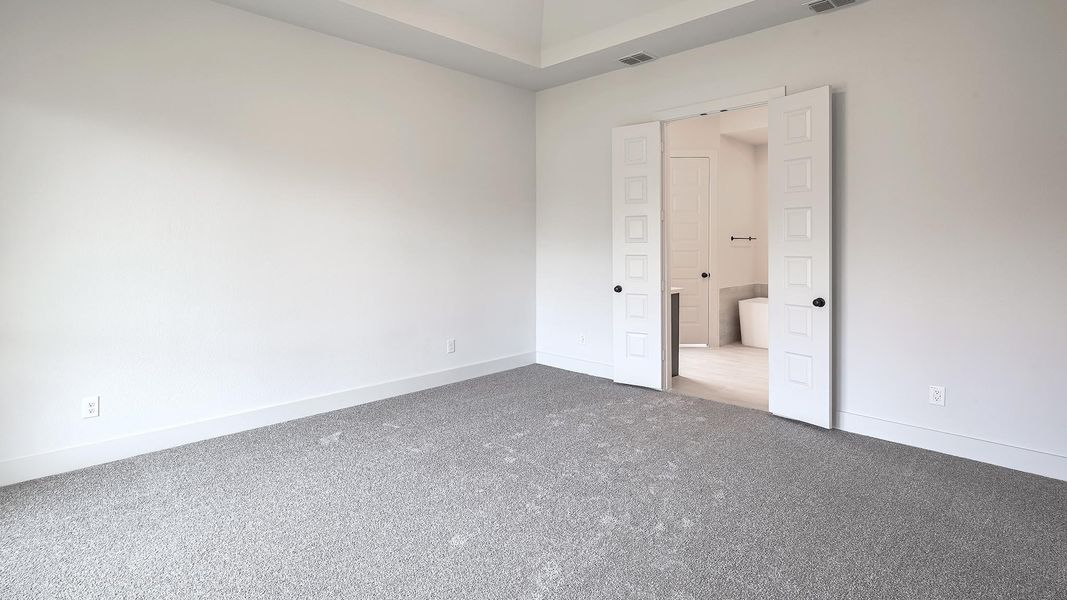Unfurnished bedroom with baseboards and carpet floors