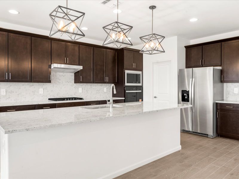 Front exterior of a new home in Summit at Rocking K, Tucson, AZ, highlighting curb appeal (Image 1).