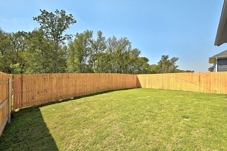 Exterior details and patio area of a home in Trinity Ranch, Elgin (Image 23).