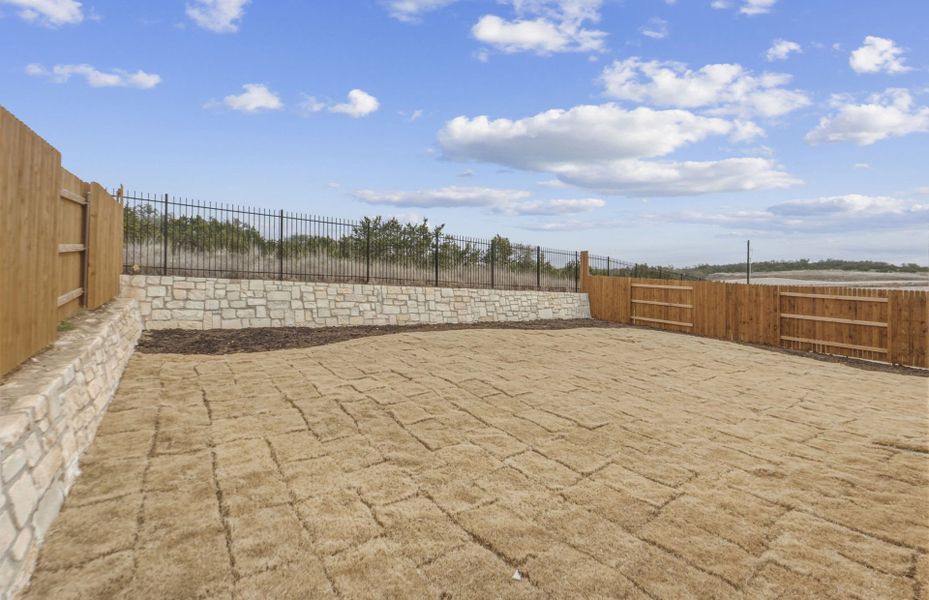 Exterior details and patio area of a home in West Cypress Hills, Spicewood (Image 29).
