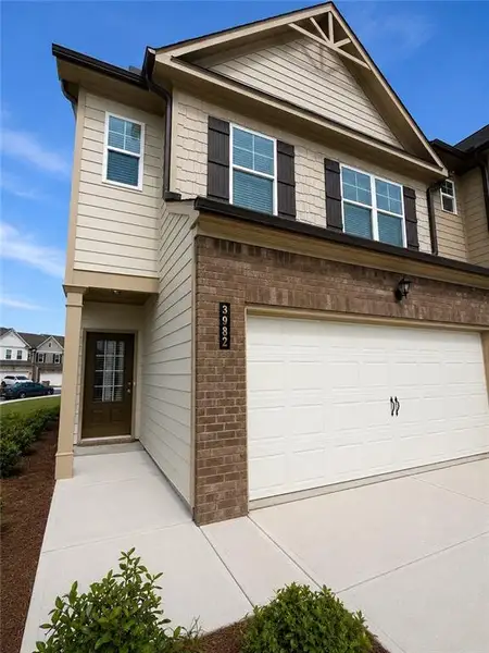 Front exterior of a new home in Somerset at Riverbrook, Gainesville, GA, highlighting curb appeal (Image 21).