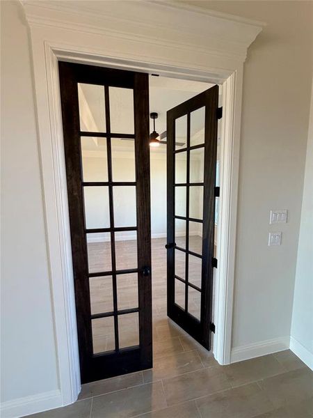 Detailed view of french doors and baseboards Detailed view of french doors and baseboards