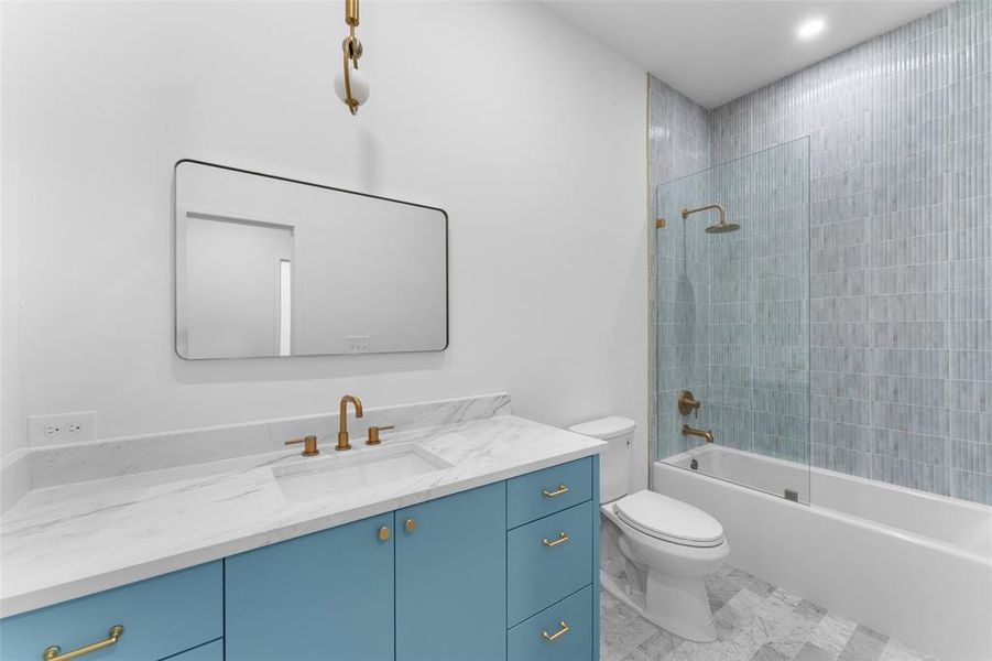 Bathroom with vanity and tub / shower combination