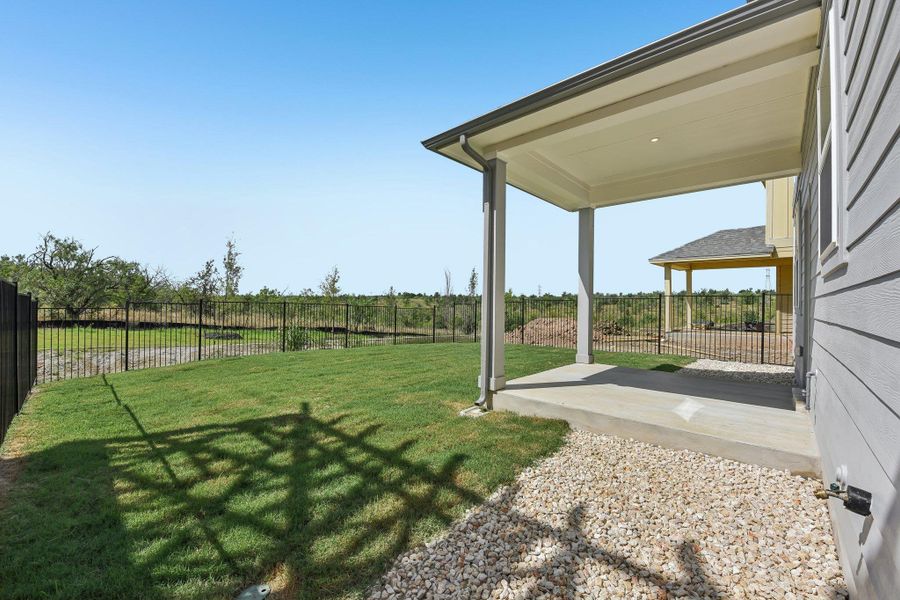 Exterior details and patio area of a home in Saddle Ridge at Wildhorse Ranch, Austin (Image 2).