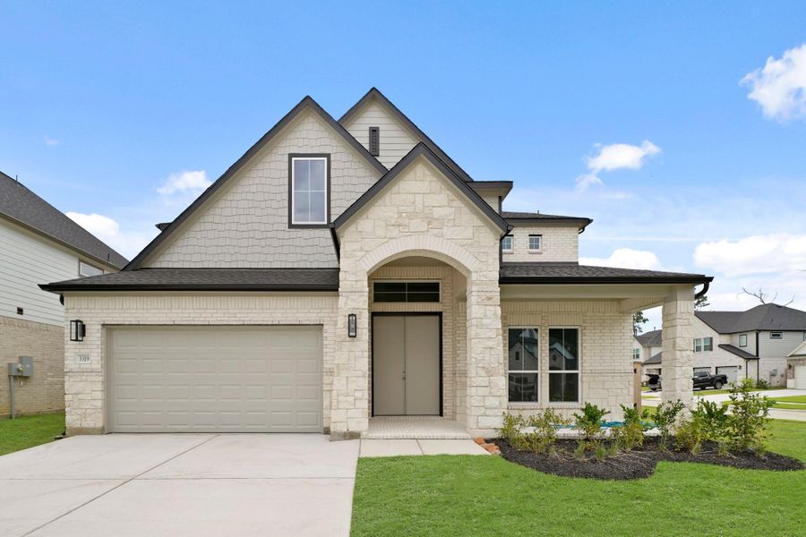 Front exterior of a new home in Barton Creek Ranch, Conroe, TX, highlighting curb appeal (Image 13). Front exterior of a new home in Barton Creek Ranch, Conroe, TX, highlighting curb appeal (Image 13).
