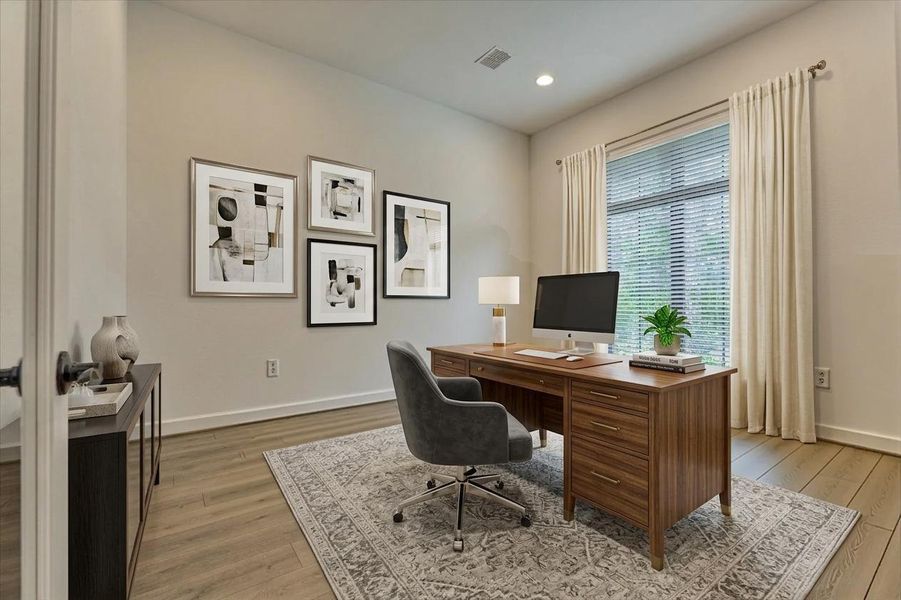 Transform your productivity in this serene home office, featuring ample natural light and a sleek, modern design perfect for focused work or creative pursuits. Virtually Staged.
