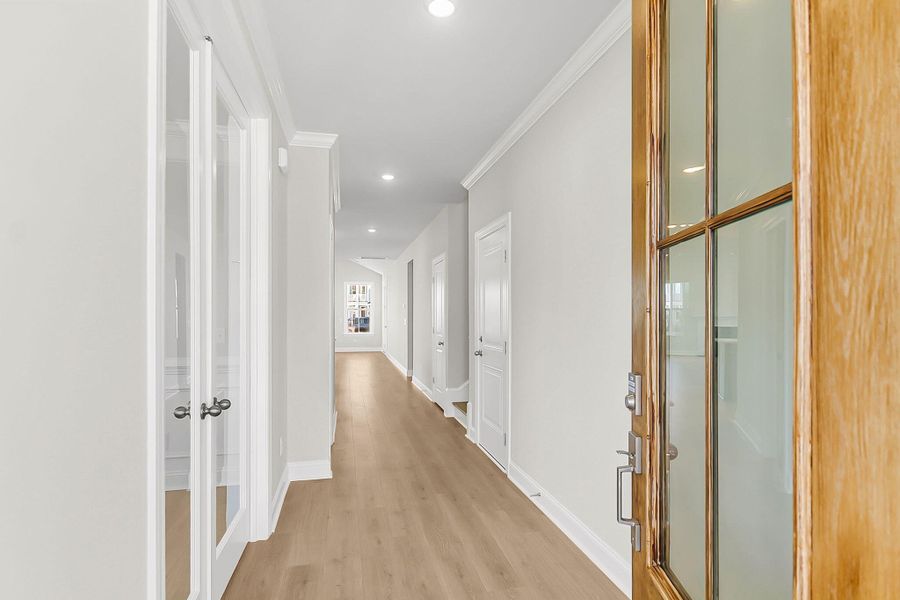 Spacious, unfurnished interior of a new home in Tidewater at Lakes of Cane Bay, Summerville (Image 19).