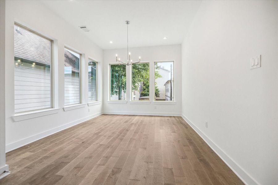 Spacious Dining Room * Windows on Two Sides * Recessed Lighting * Designer Chandelier. Spacious Dining Room * Windows on Two Sides * Recessed Lighting * Designer Chandelier.