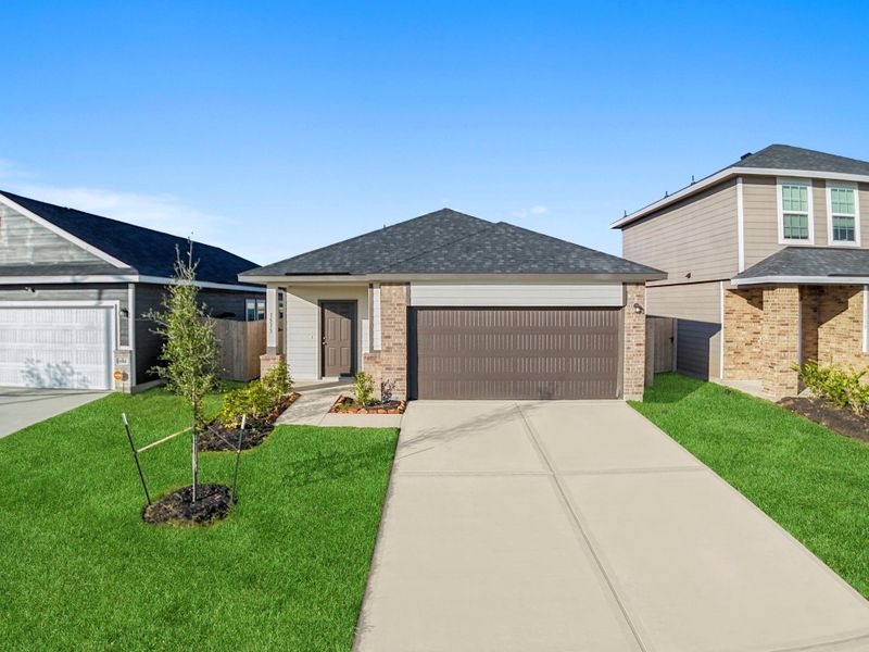 Front exterior view showcasing the Oak Plan’s timeless curb appeal with brick accents, a wide driveway, and a neatly landscaped yard that enhances the home’s inviting presence. Front exterior view showcasing the Oak Plan’s timeless curb appeal with brick accents, a wide driveway, and a neatly landscaped yard that enhances the home’s inviting presence.