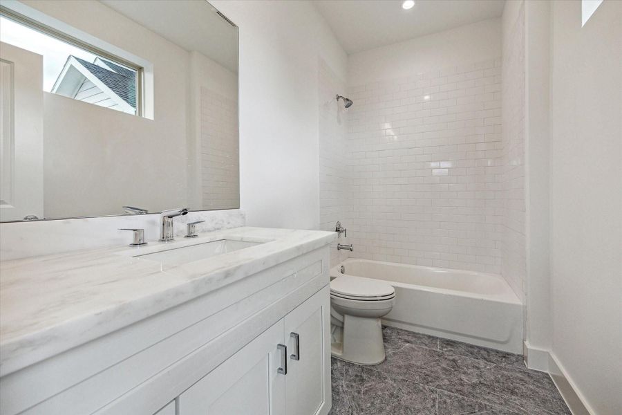 En-Suite Bathroom for the Secondary Bedroom on the Third Floor * Marble and Subway Tile and Porcelain Floor.