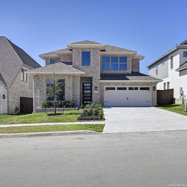 Front exterior of a new home in Corley Farms, Boerne, TX, highlighting curb appeal (Image 2).