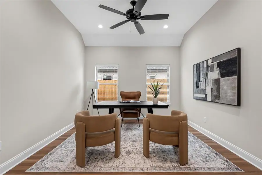 Home office featuring dark wood finished floors, ceiling fan, and recessed lighting Home office featuring dark wood finished floors, ceiling fan, and recessed lighting